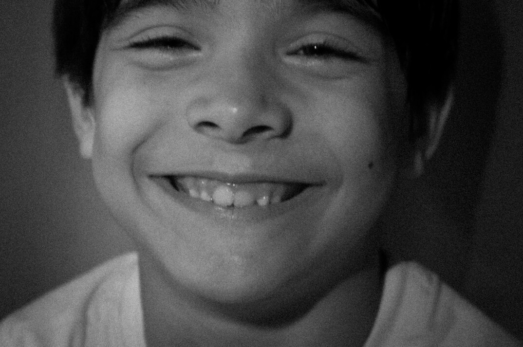 Portrait of a smiling man with short dark hair